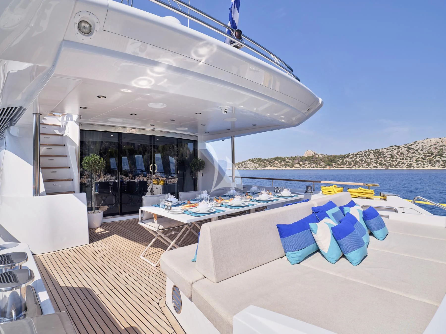 a room with a table and chairs aboard HAKUNA MATATA Yacht for Charter