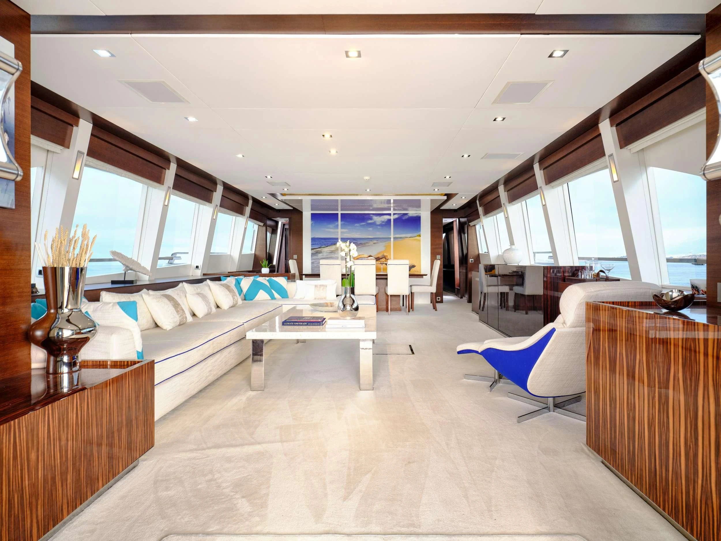 a large room with a couch and a table aboard HAKUNA MATATA Yacht for Charter