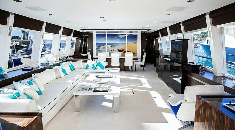 a living room with a large window aboard HAKUNA MATATA Yacht for Charter