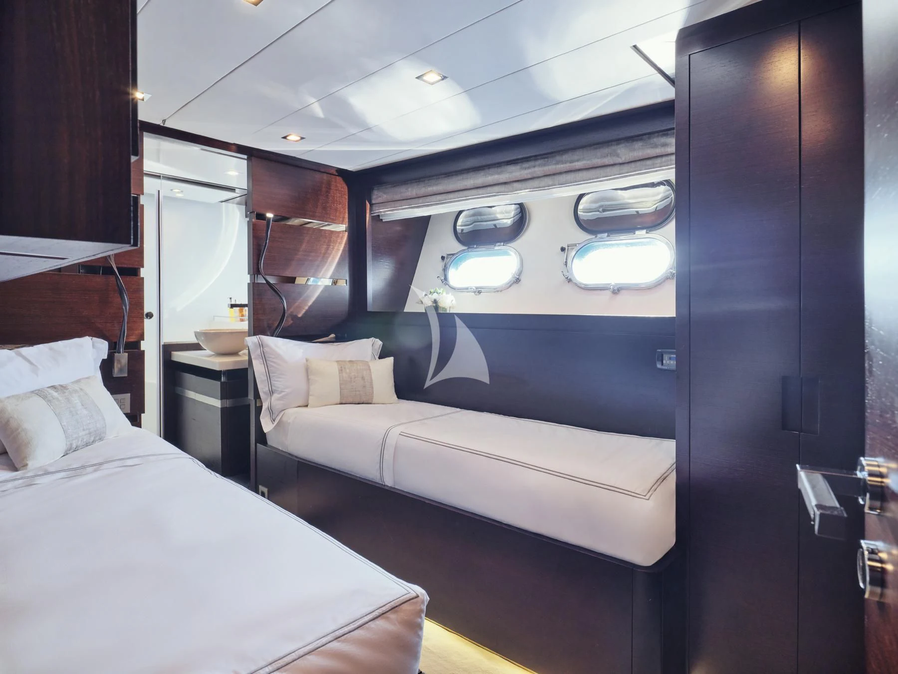 a room with a bed and a mirror aboard HAKUNA MATATA Yacht for Charter