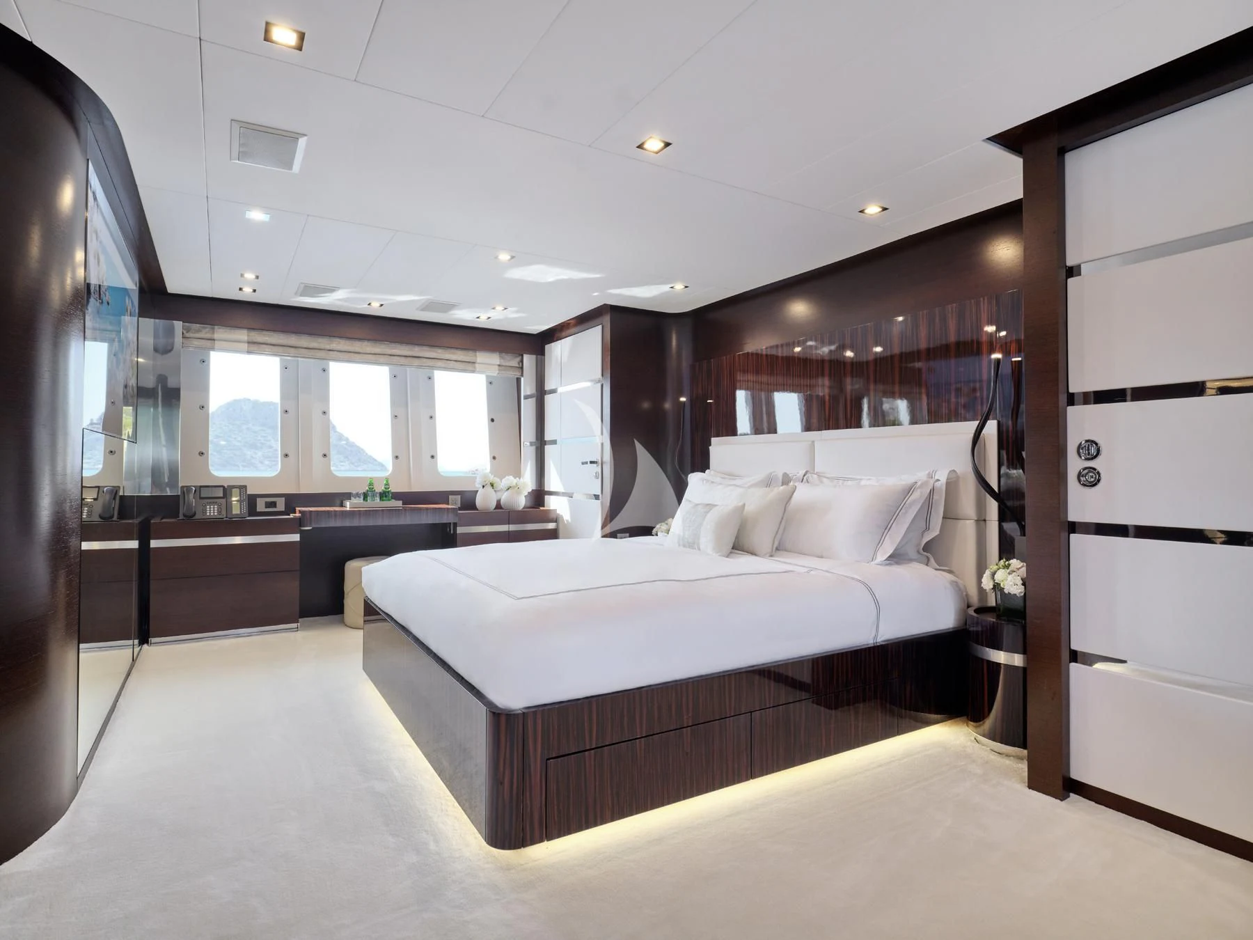 a large bedroom with a large bed aboard HAKUNA MATATA Yacht for Charter