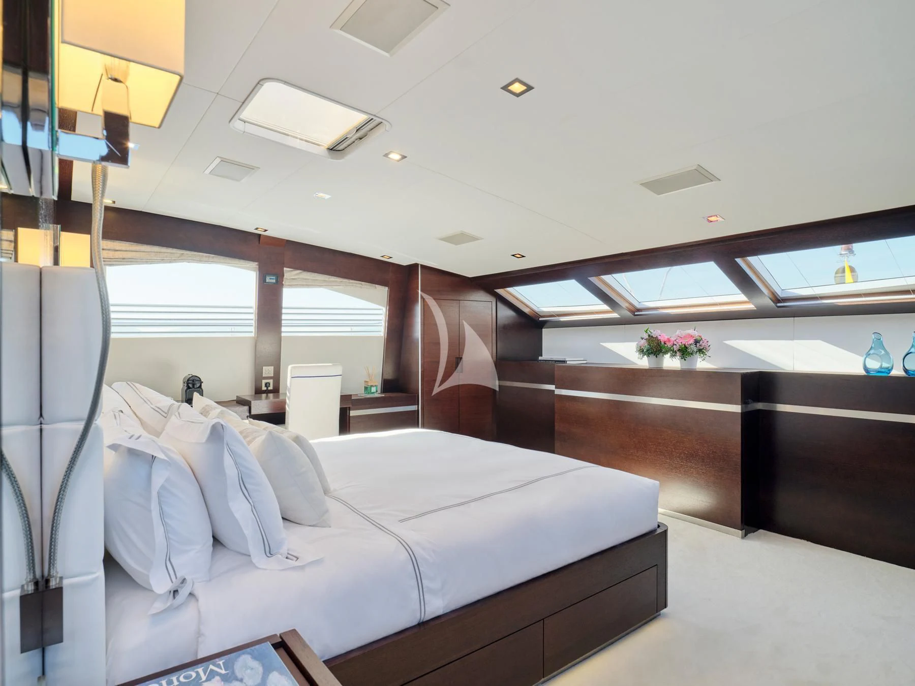a room with a bed and a desk aboard HAKUNA MATATA Yacht for Charter