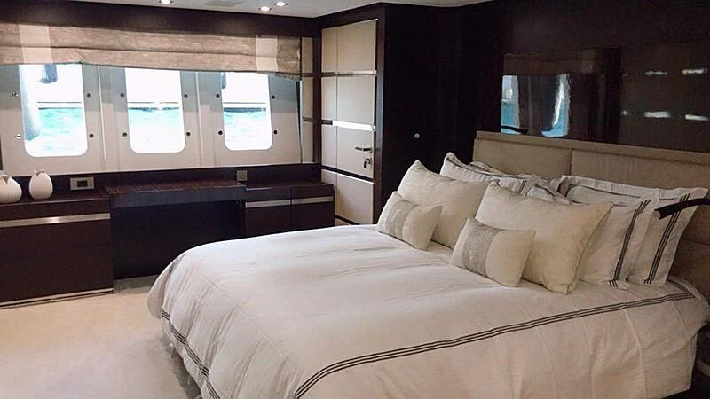 a bed with pillows aboard HAKUNA MATATA Yacht for Charter