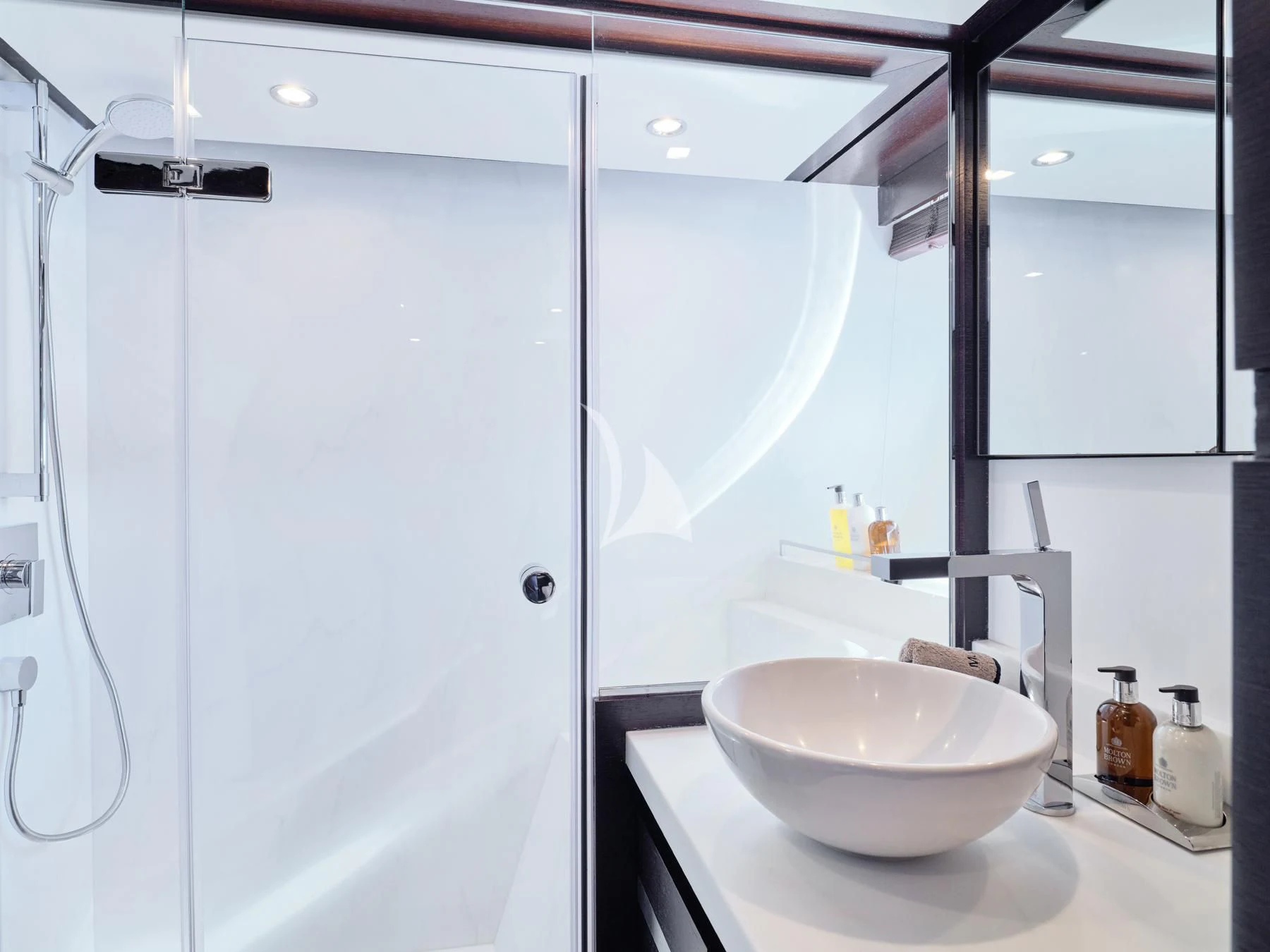 a bathroom with a sink and a shower aboard HAKUNA MATATA Yacht for Charter