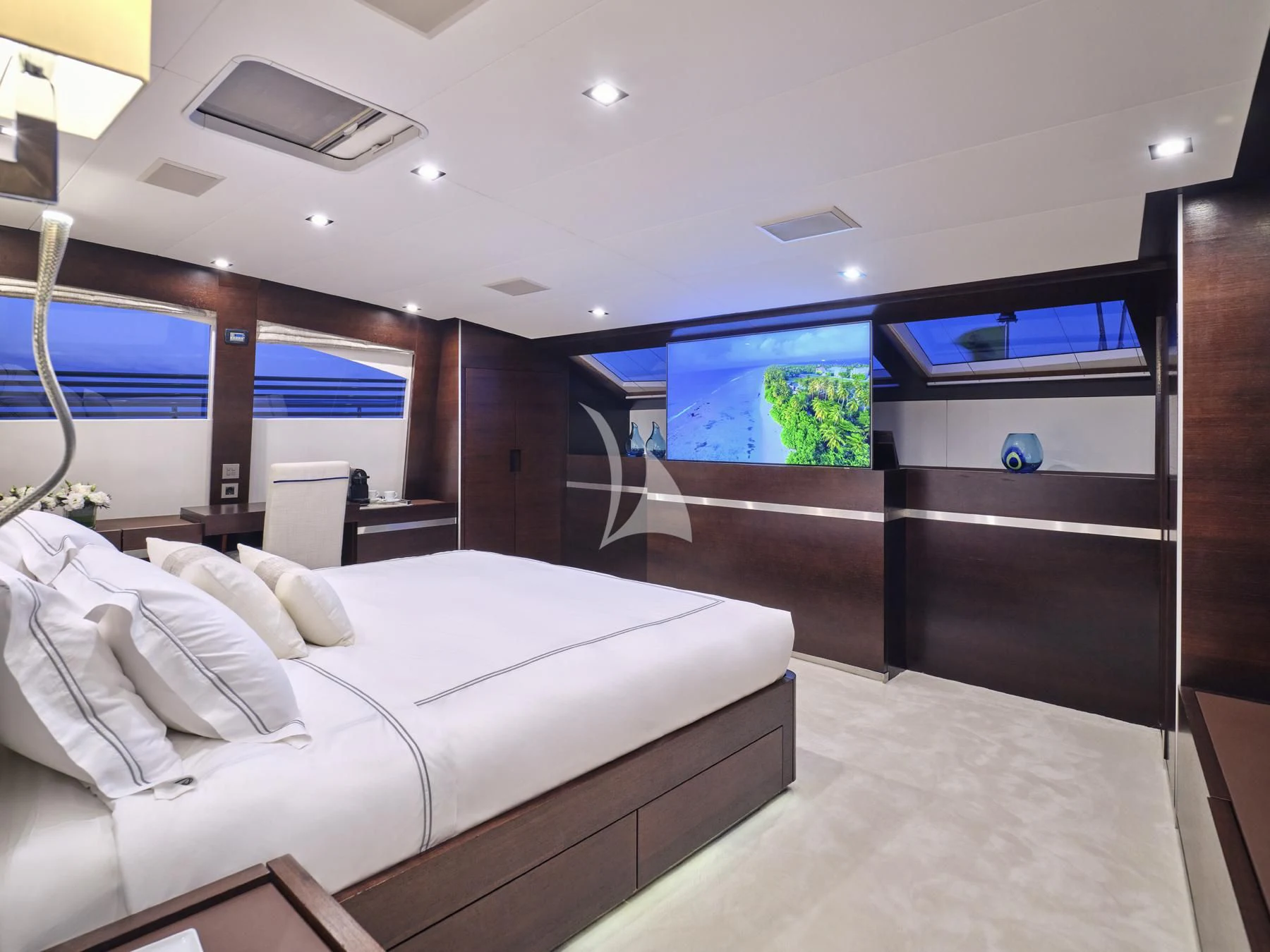 a room with a couch and a television aboard HAKUNA MATATA Yacht for Charter