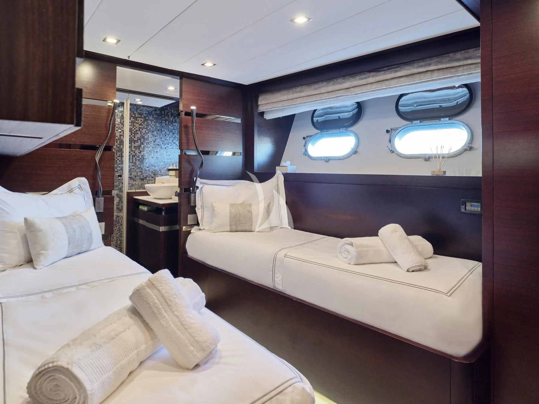 a room with a bed and a mirror aboard HAKUNA MATATA Yacht for Charter