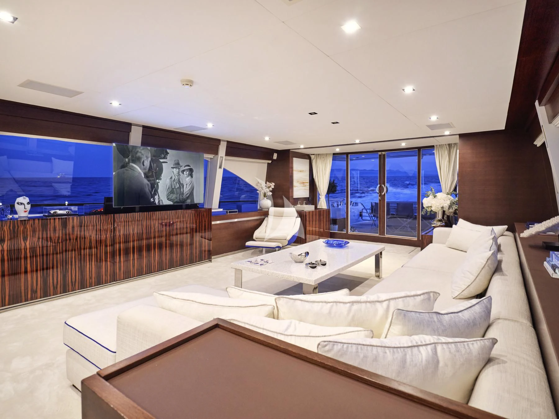 a room with a bed and a window aboard HAKUNA MATATA Yacht for Charter
