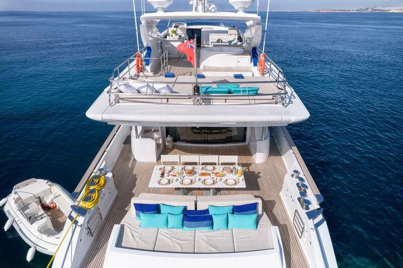 a boat with a beach chair on it aboard HAKUNA MATATA Yacht for Charter