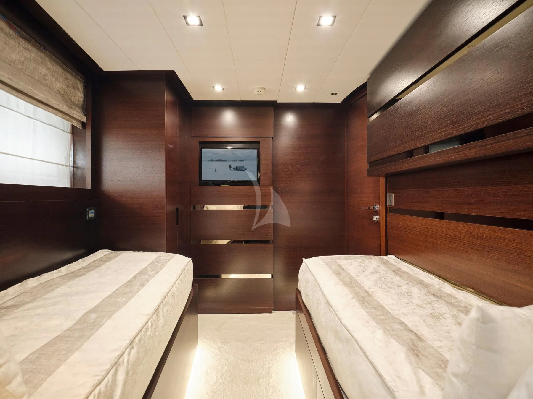 a room with a bed and a tv aboard HAKUNA MATATA Yacht for Charter