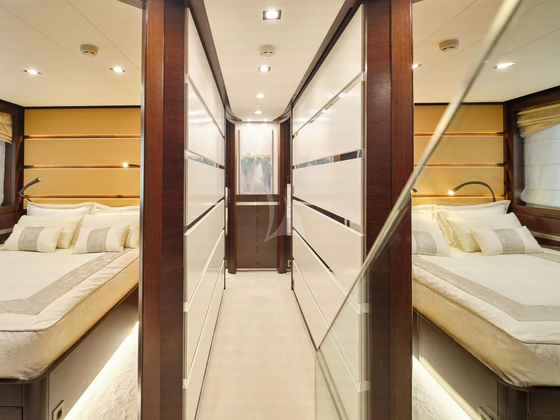 a room with a bed and a mirror aboard HAKUNA MATATA Yacht for Charter