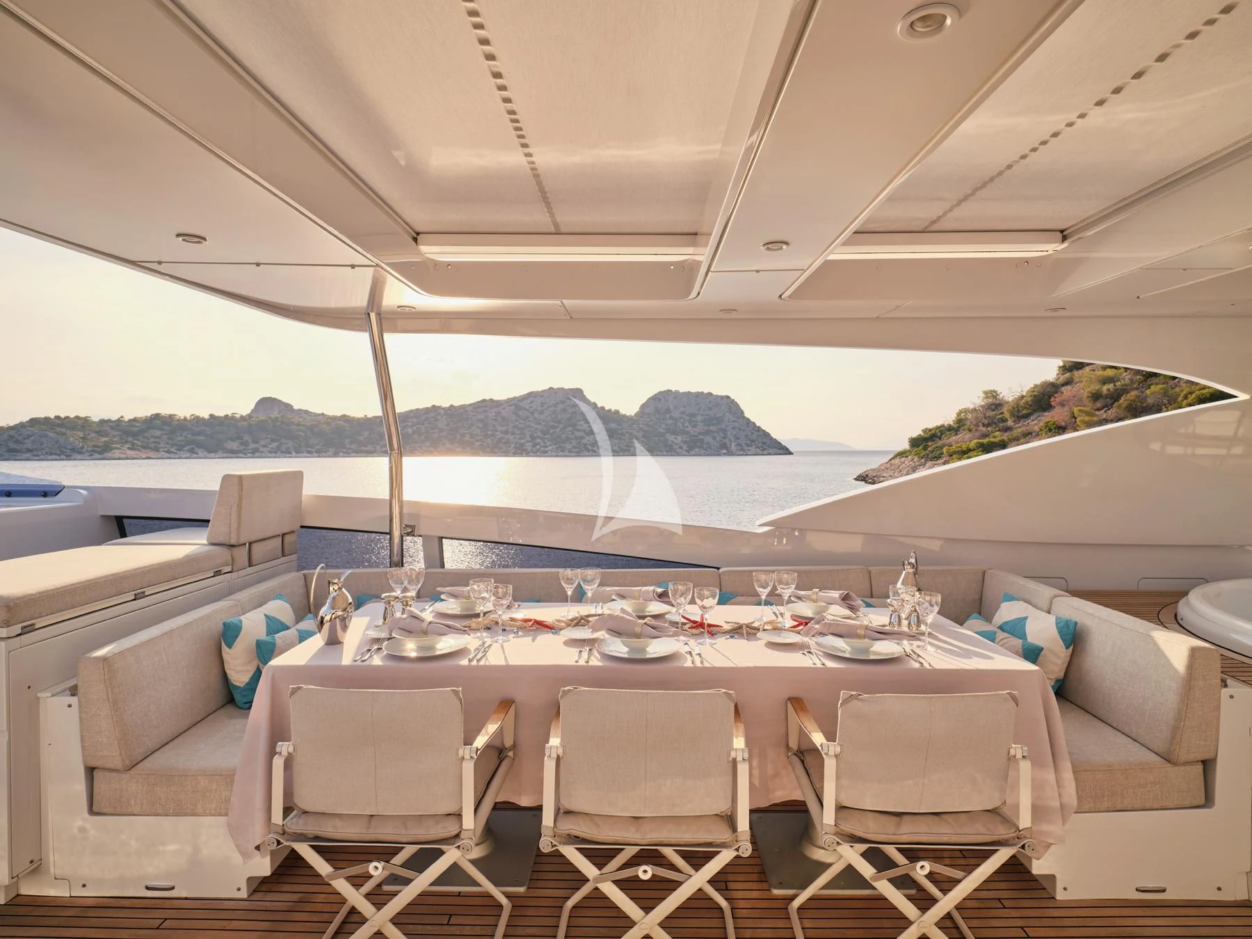 a table with chairs on it aboard HAKUNA MATATA Yacht for Charter