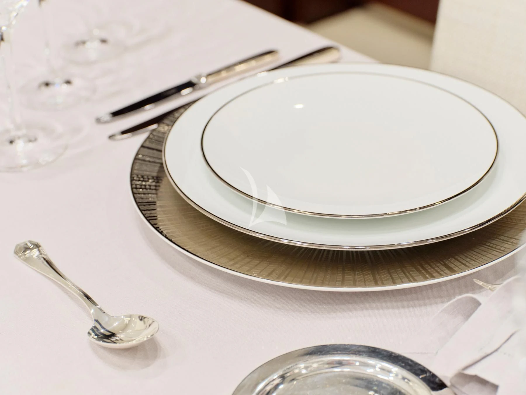 a plate with a spoon on it aboard HAKUNA MATATA Yacht for Charter