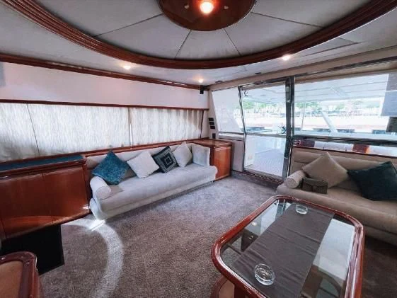 a bedroom with a bed and a couch aboard SOFIA Yacht for Sale