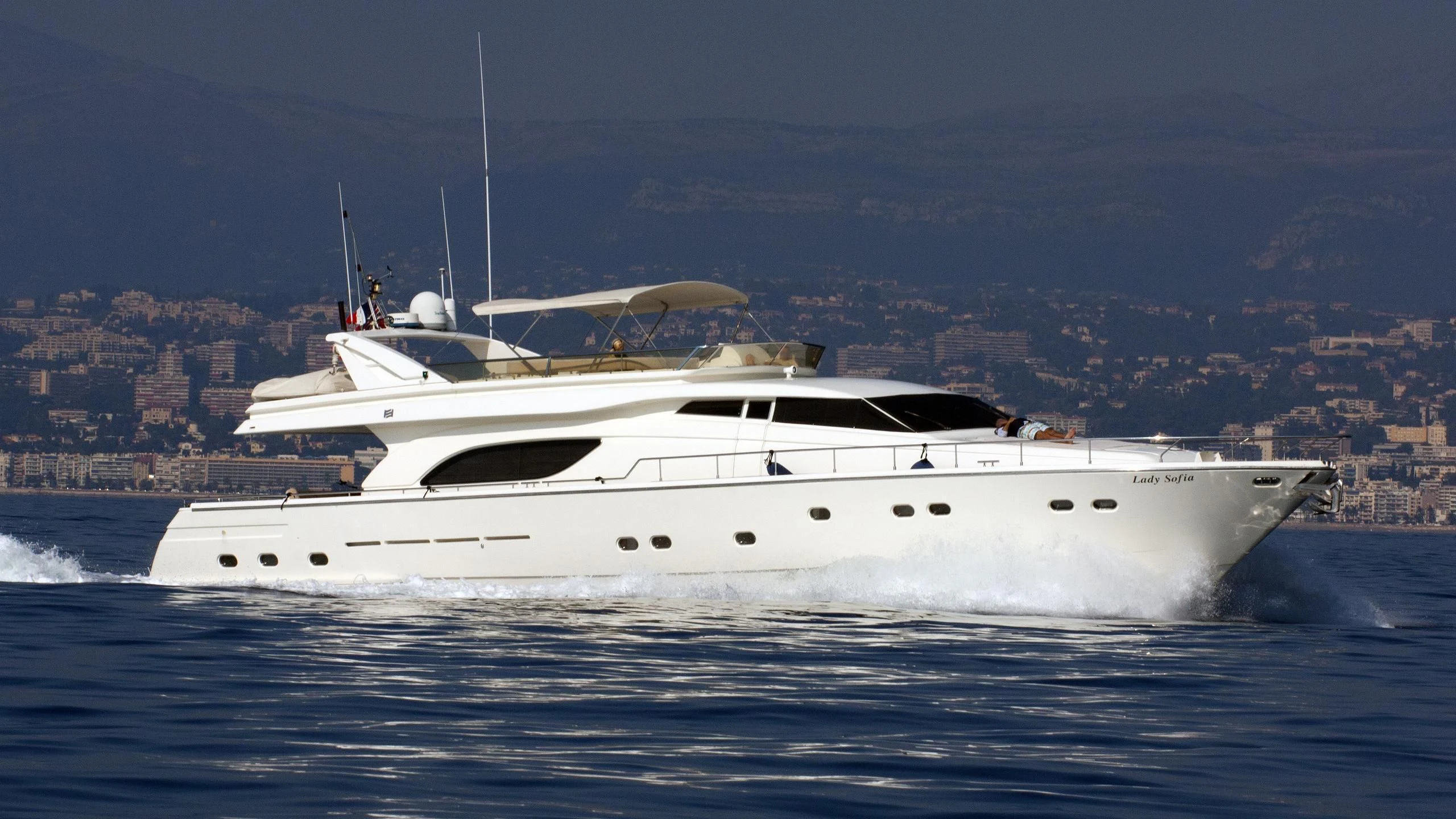 a white yacht on the water aboard SOFIA Yacht for Sale