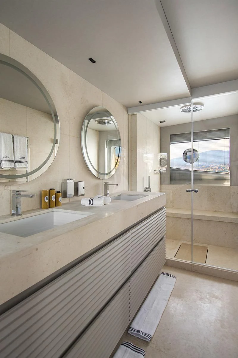 a bathroom with a large mirror aboard ANGIOLA Yacht for Sale