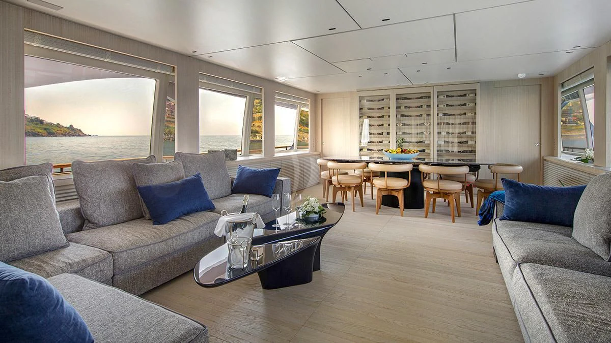 a living room with a couch and a table aboard ANGIOLA Yacht for Sale
