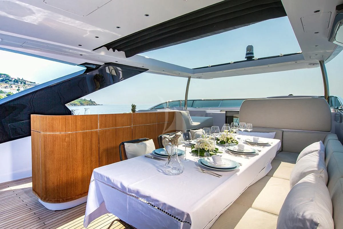 a table with plates and glasses on it aboard ANGIOLA Yacht for Sale