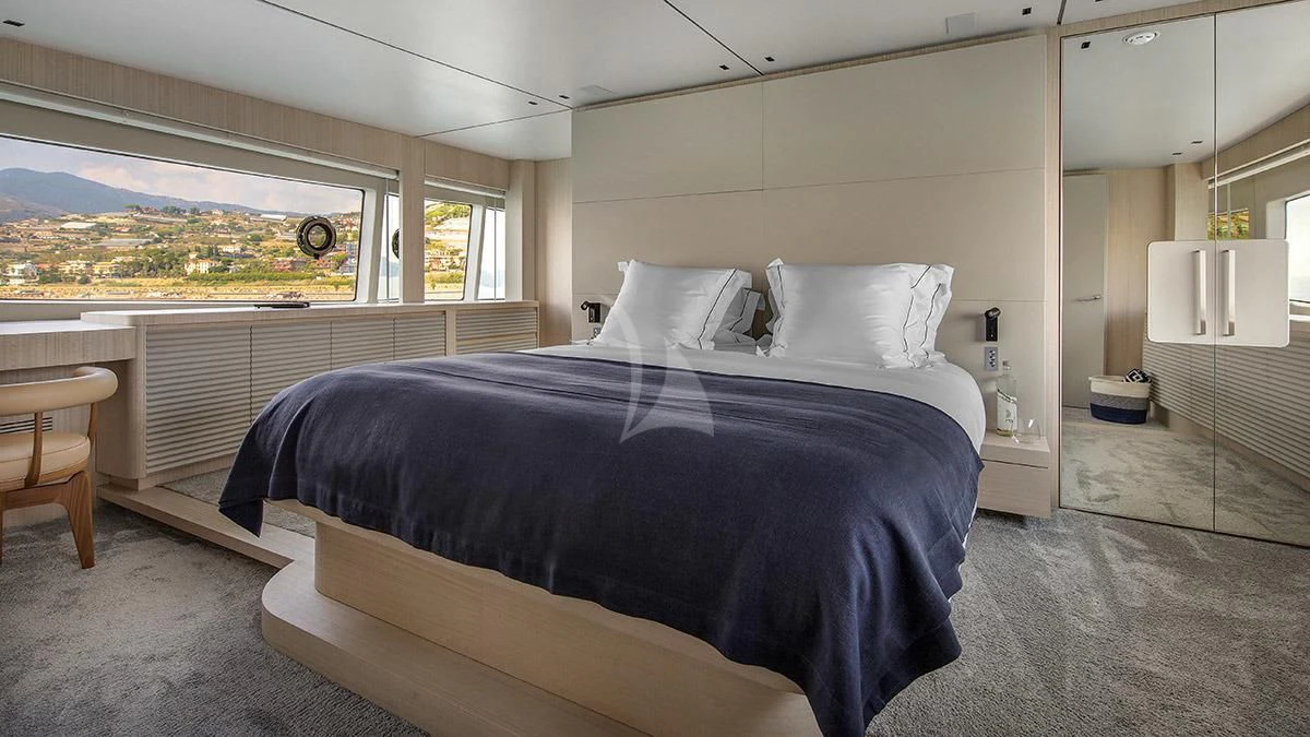 a bedroom with a large bed aboard ANGIOLA Yacht for Sale