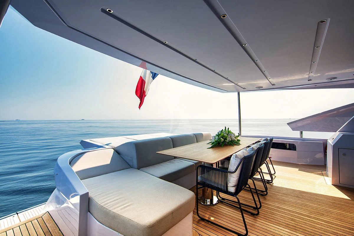 a room with a table and chairs aboard ANGIOLA Yacht for Sale