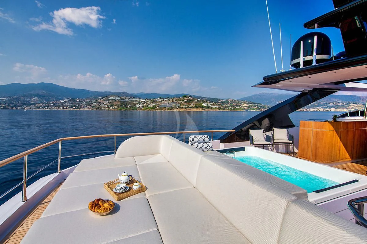 a balcony with a view of a city and water aboard ANGIOLA Yacht for Sale