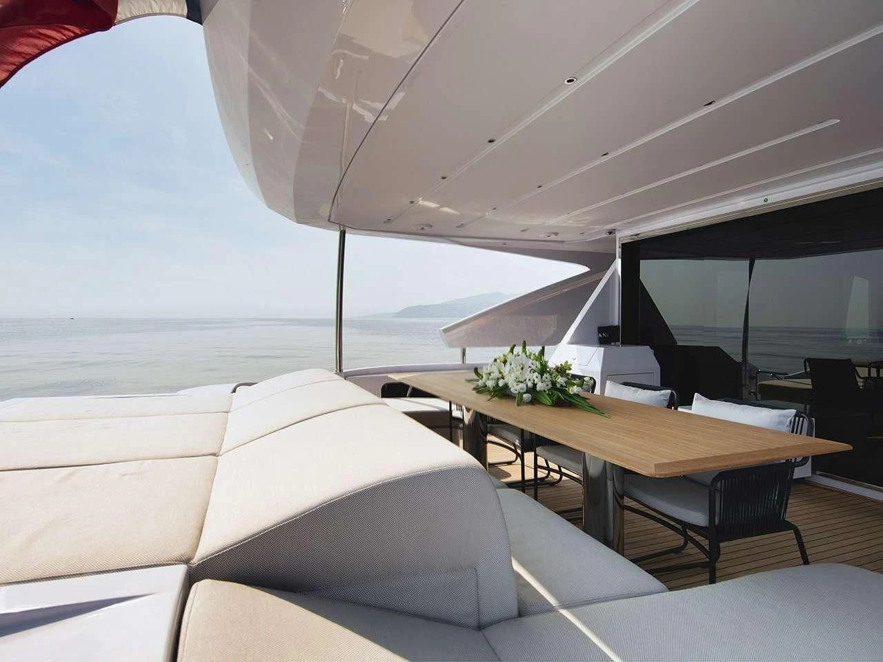 a room with a table and chairs aboard ANGIOLA Yacht for Sale