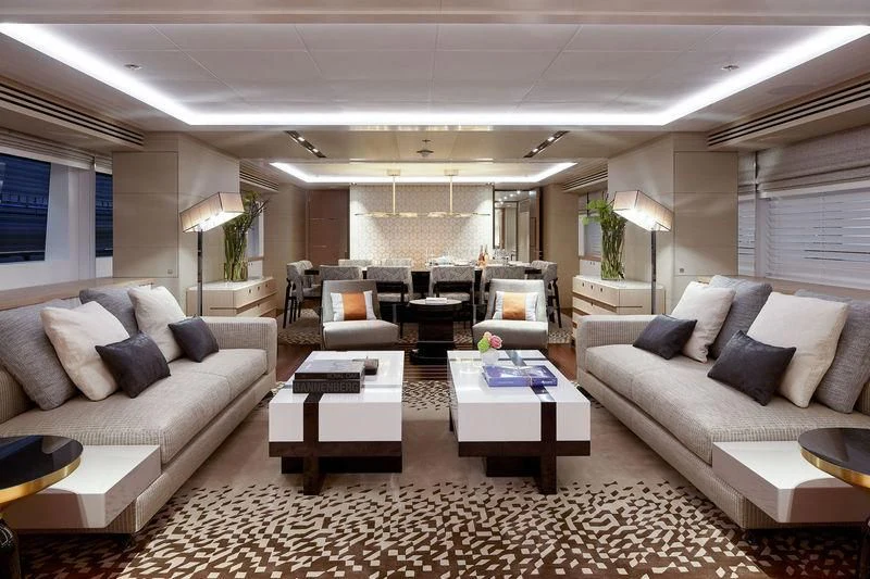 a living room with a couch and a coffee table aboard ARTISA Yacht for Sale