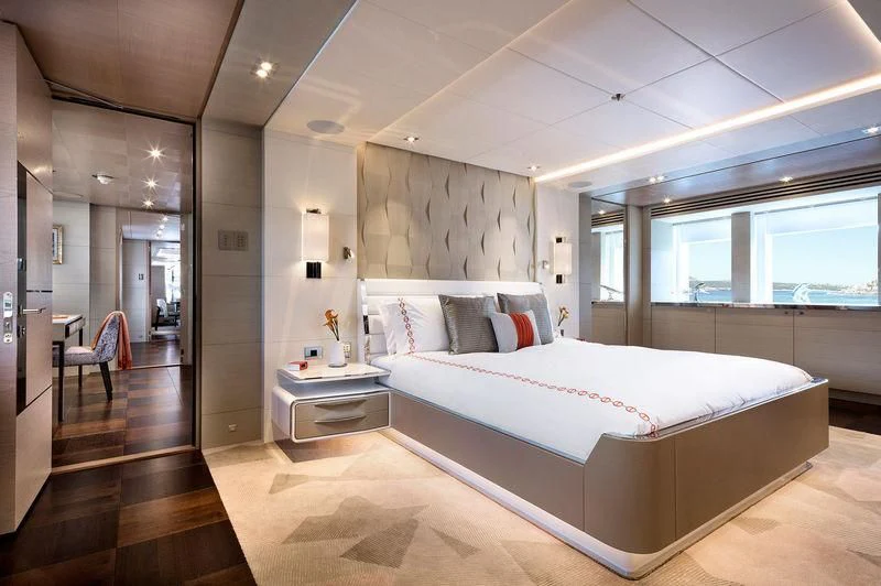 a large bedroom with a large bed aboard ARTISA Yacht for Sale