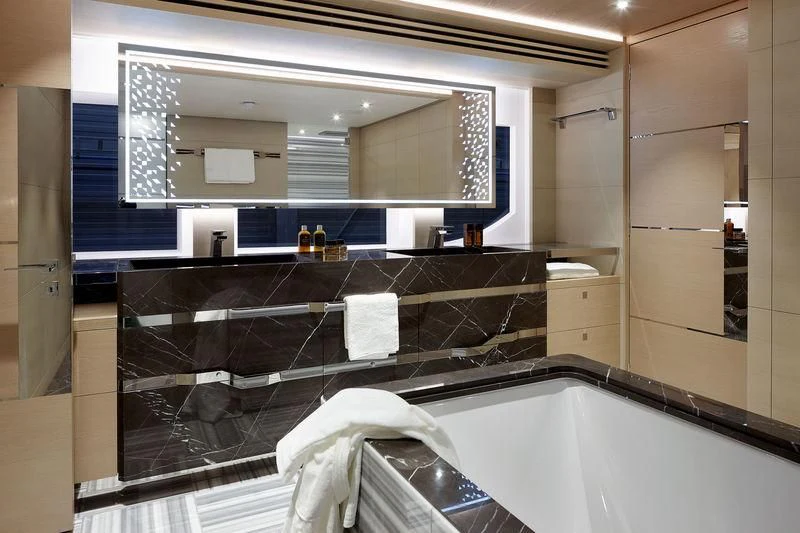 a bathroom with a large mirror aboard ARTISA Yacht for Sale