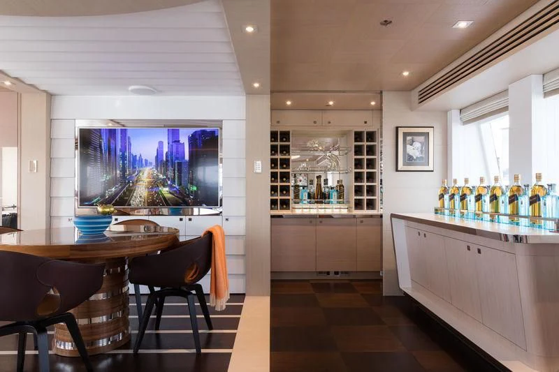 a room with a table and chairs aboard ARTISA Yacht for Sale