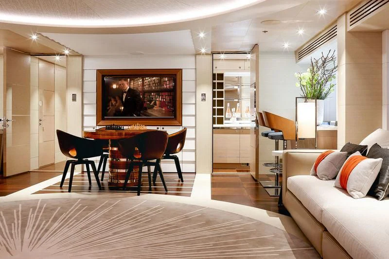 a living room with a large tv aboard ARTISA Yacht for Sale
