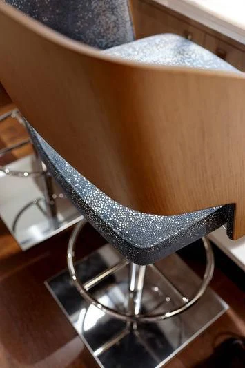 a brown leather chair aboard ARTISA Yacht for Sale
