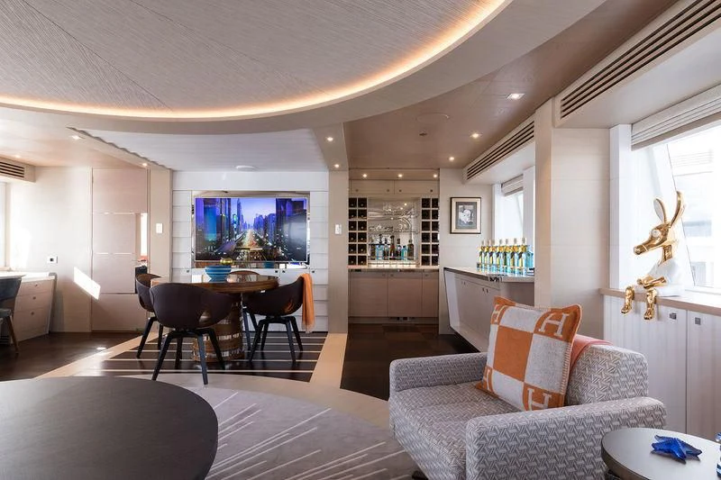 a living room with a large window aboard ARTISA Yacht for Sale