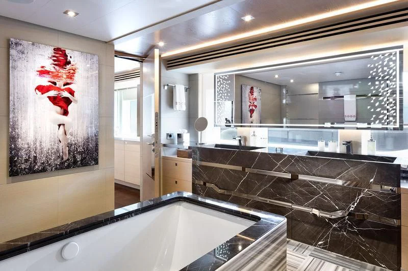 a large bathroom with a large glass window aboard ARTISA Yacht for Sale