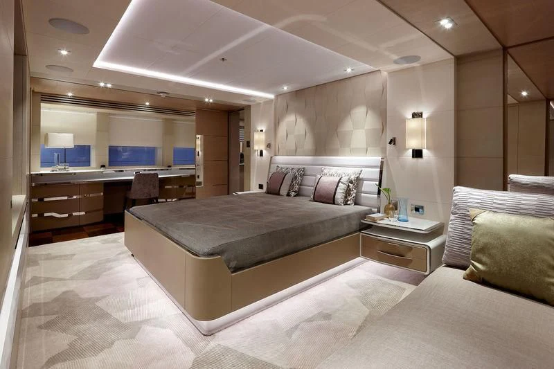 a large bedroom with a bed aboard ARTISA Yacht for Sale