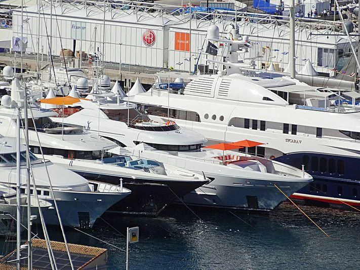 several boats docked at a pier aboard ARTISA Yacht for Sale