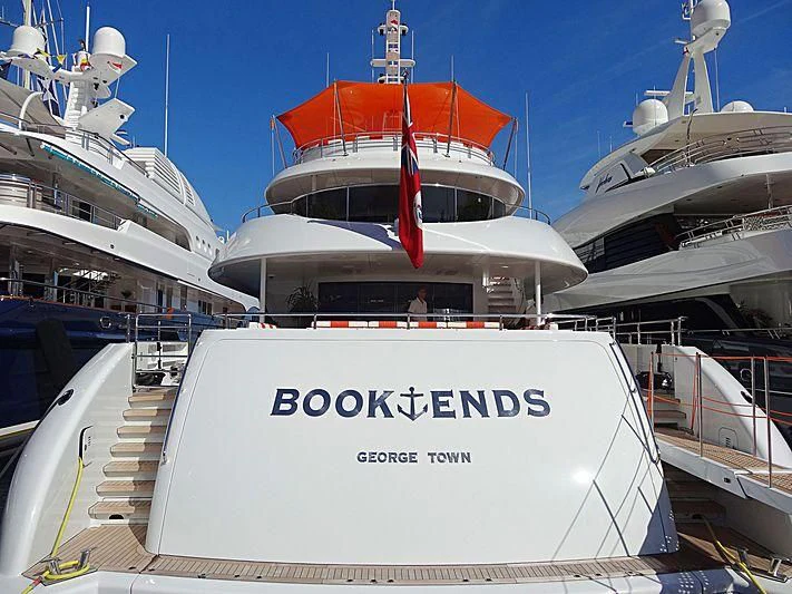 a large white boat in a harbor aboard ARTISA Yacht for Sale