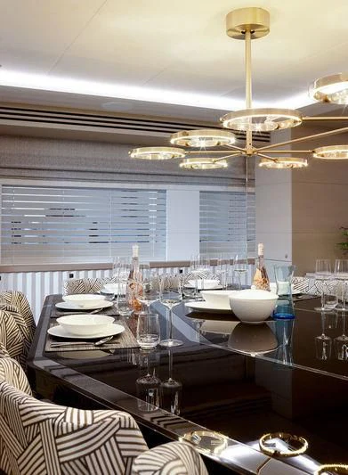 a table with plates and glasses aboard ARTISA Yacht for Sale