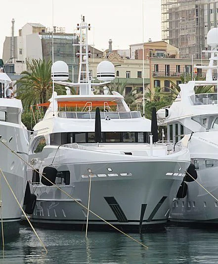 a boat docked in a harbor aboard ARTISA Yacht for Sale