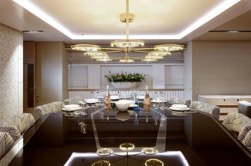 a large dining room with a chandelier aboard ARTISA Yacht for Sale