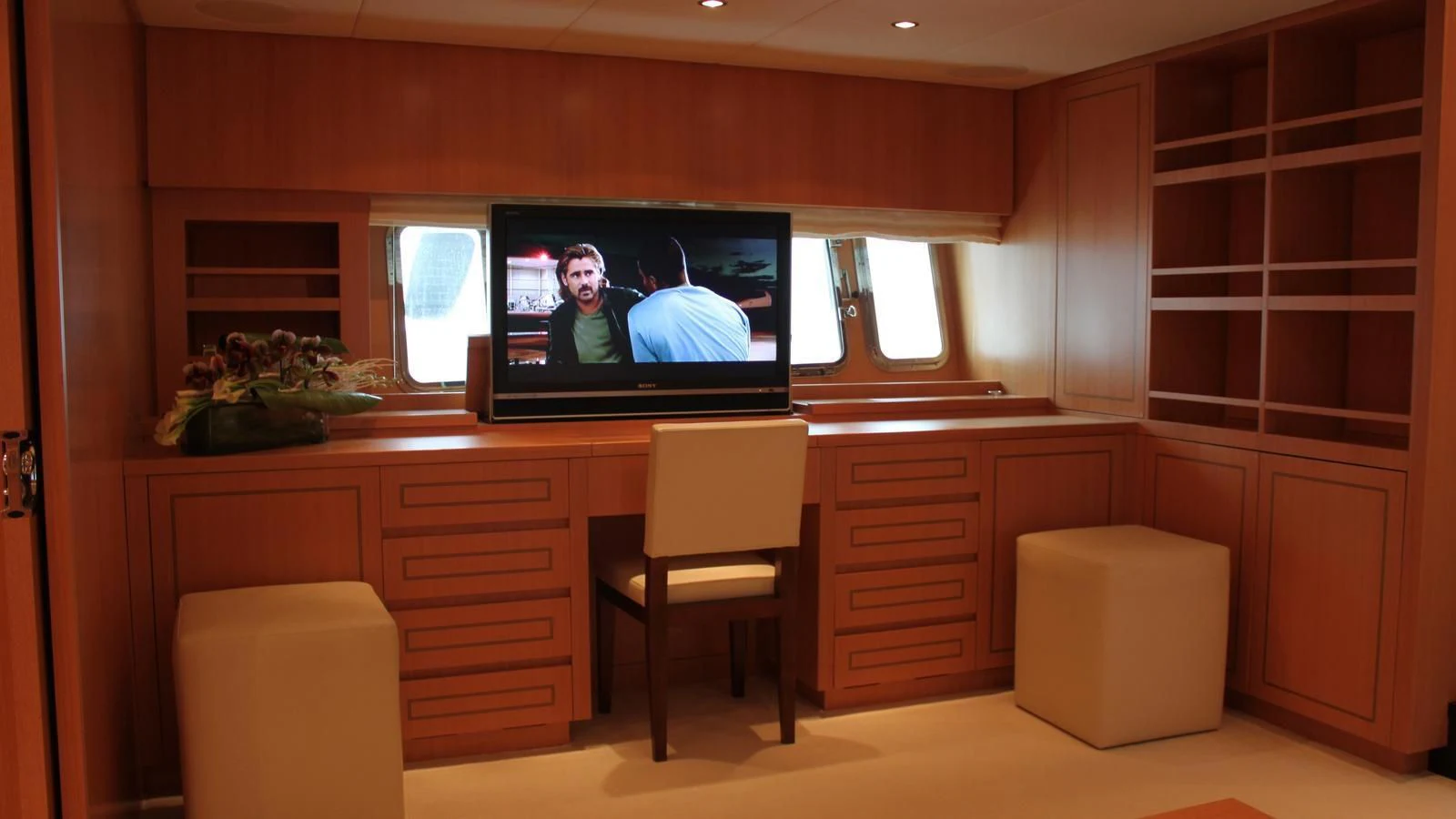 a room with a tv and a chair aboard MAZAG Yacht for Sale