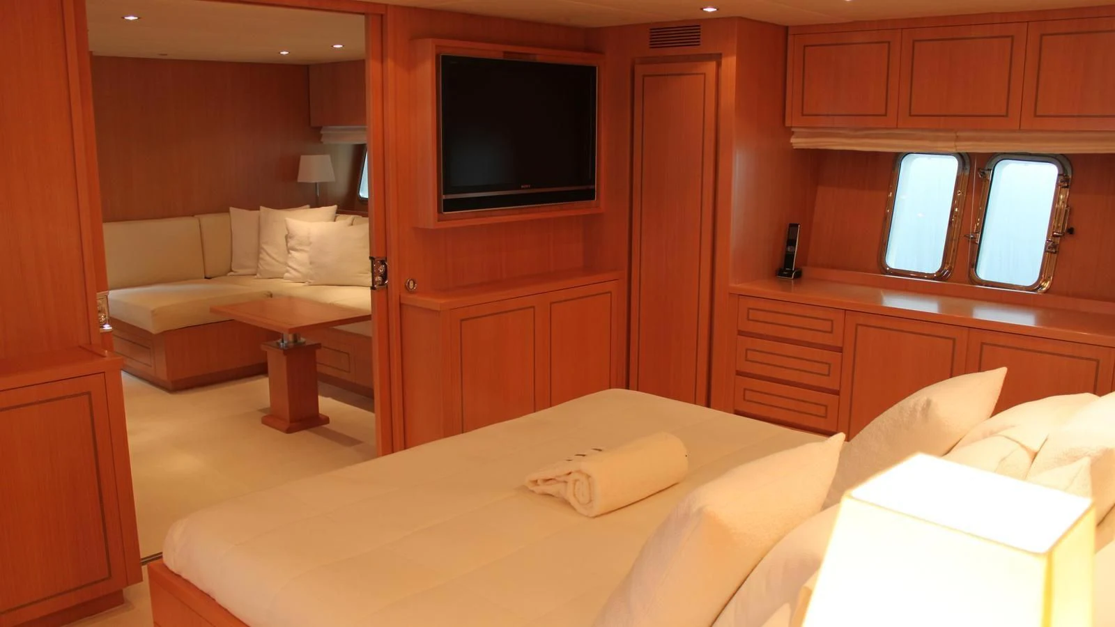a room with a bed and a television aboard MAZAG Yacht for Sale