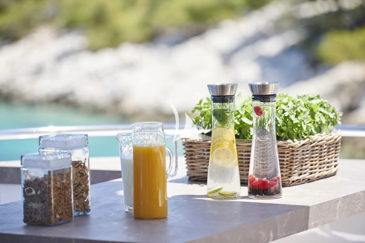 a table with drinks and fruits aboard PROMETHEUS I Yacht for Charter