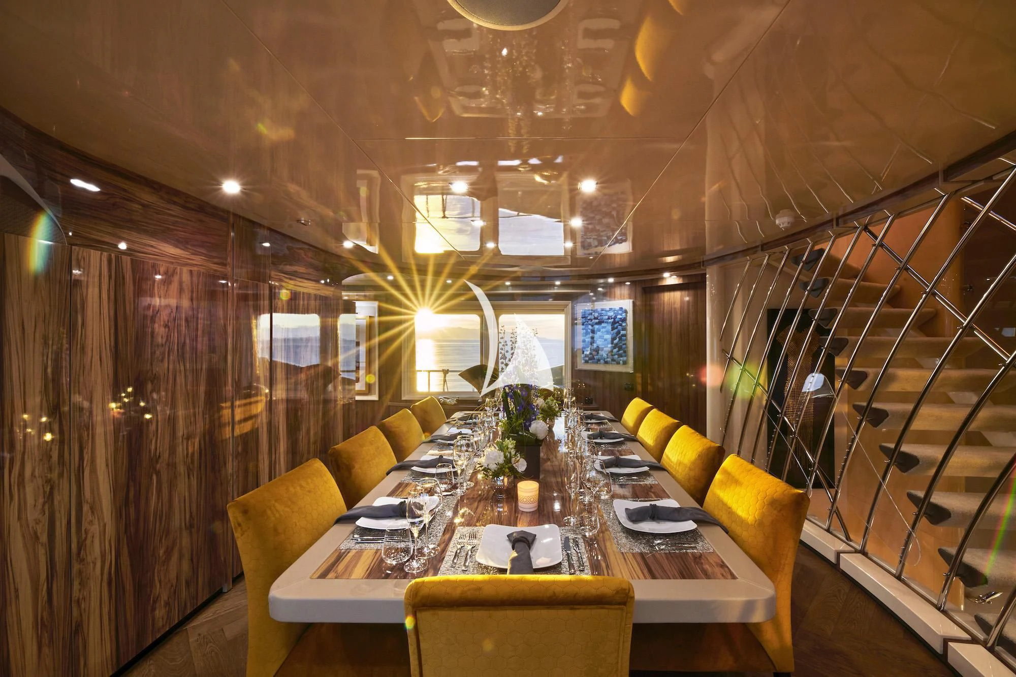 a room with a table and chairs aboard PROMETHEUS I Yacht for Charter