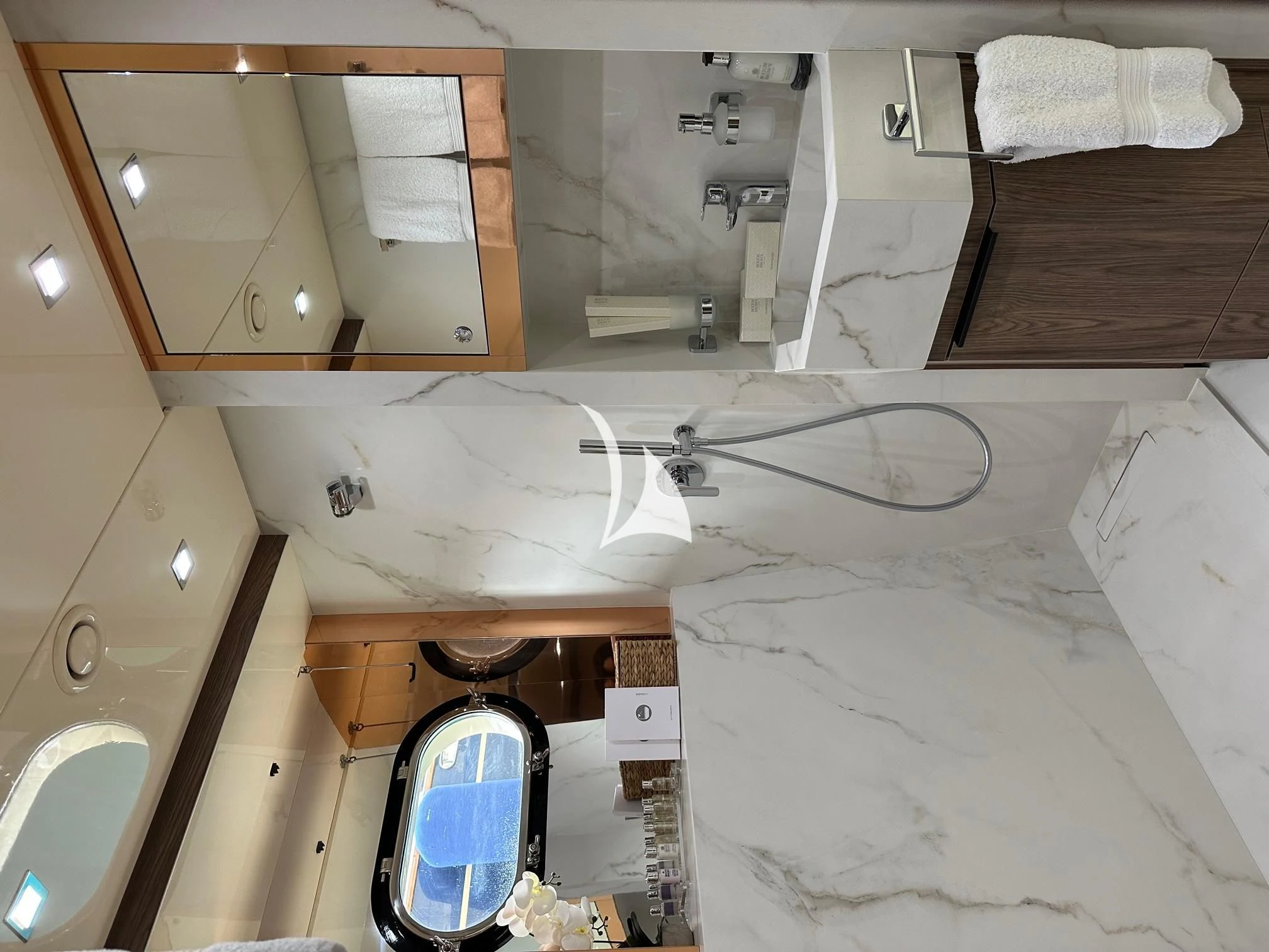 a bathroom with a sink and a mirror aboard PROMETHEUS I Yacht for Charter