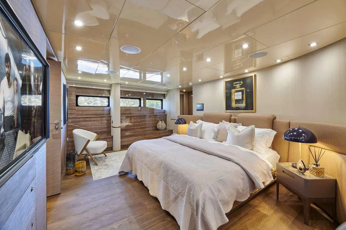 a bedroom with a large bed aboard PROMETHEUS I Yacht for Charter