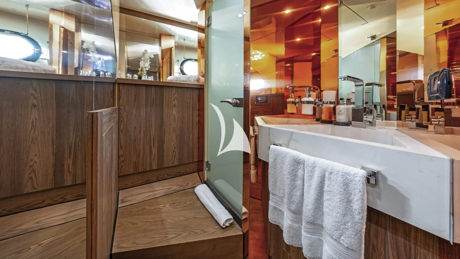 a bathroom with a bathtub and sink aboard PROMETHEUS I Yacht for Charter
