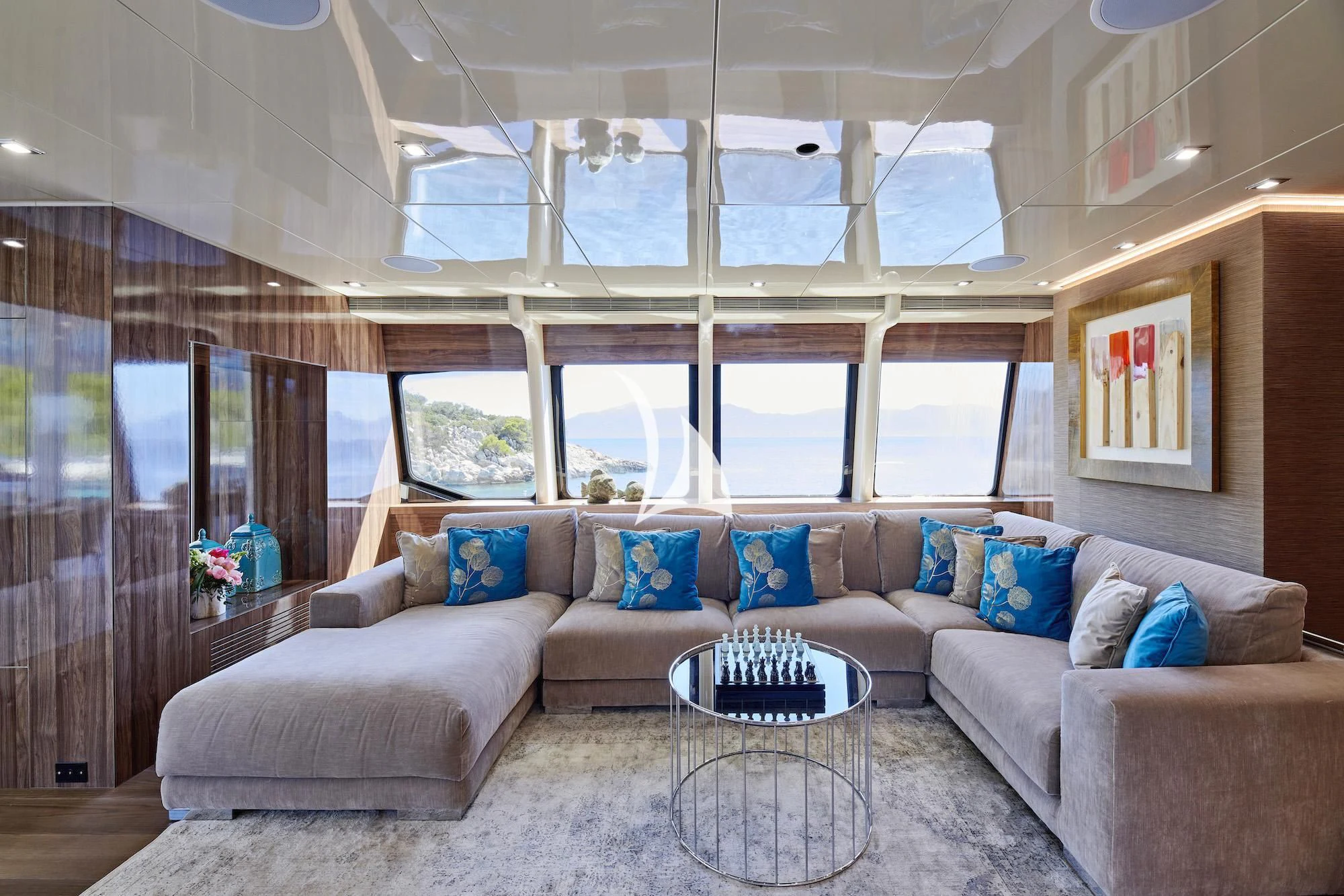 a living room with a couch and a table aboard PROMETHEUS I Yacht for Charter