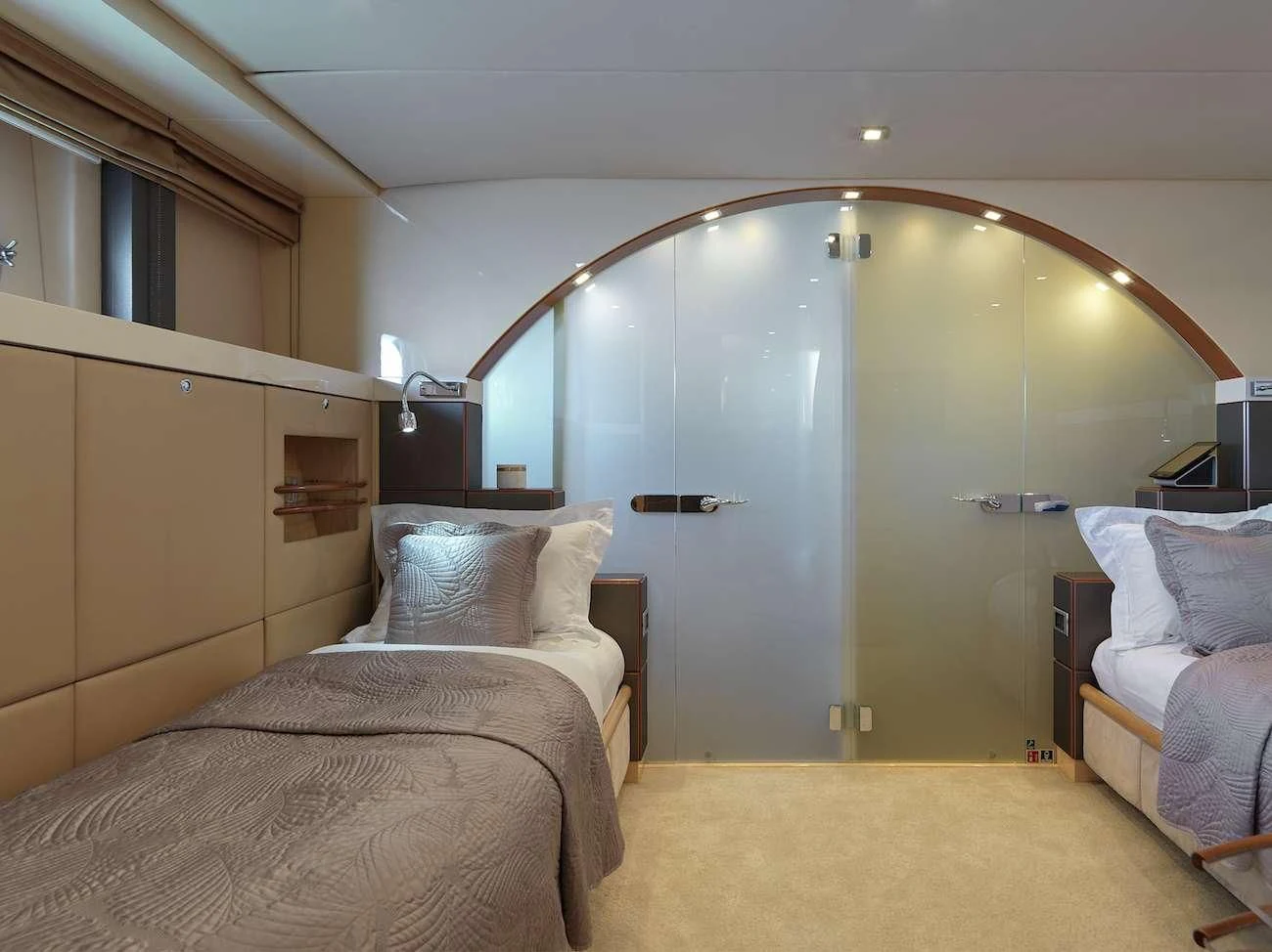 a room with a bed and a mirror aboard PROMETHEUS I Yacht for Charter