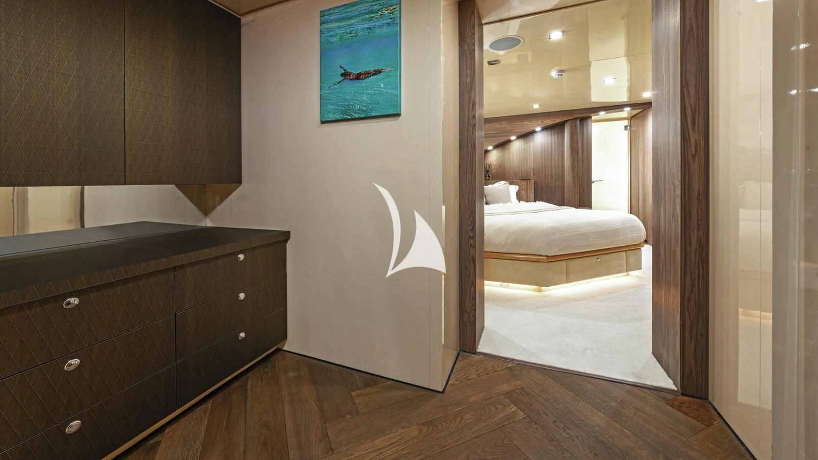 a room with a bed and a mirror aboard PROMETHEUS I Yacht for Charter