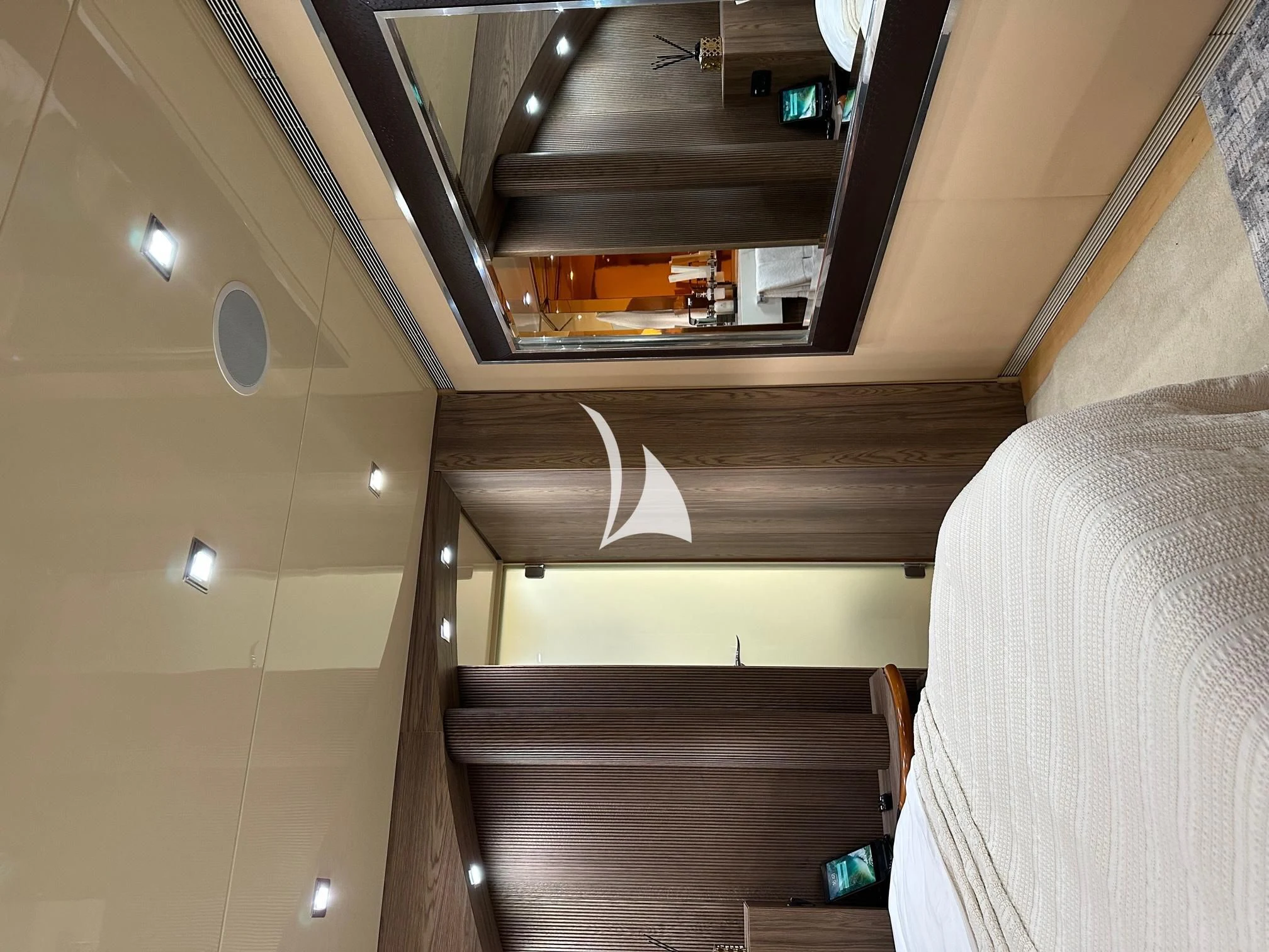 a room with a bed and a desk aboard PROMETHEUS I Yacht for Charter